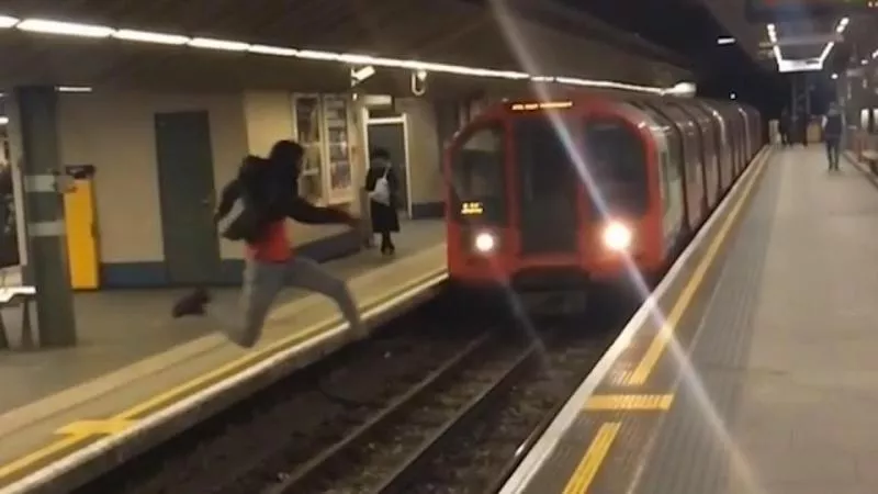idiot leaps across train tracks - Sakshi