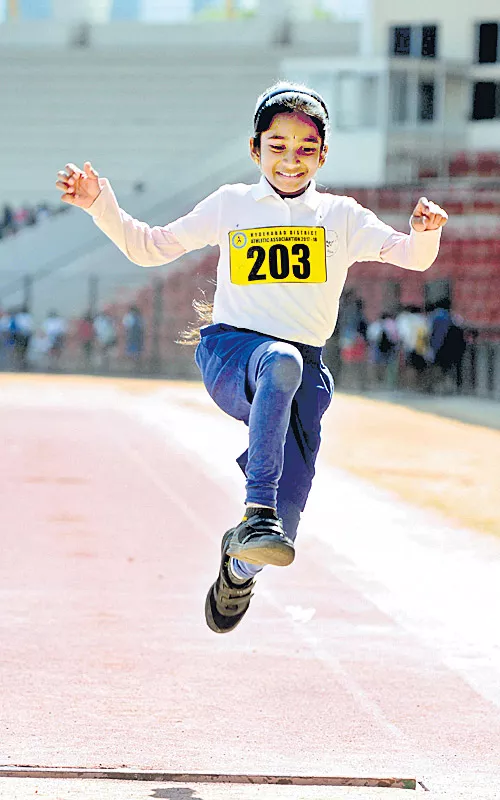 yogitha wins gold medal in long jump - Sakshi