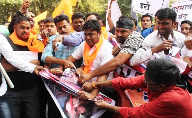 Karni Sena men set fire to fellow activist car - Sakshi