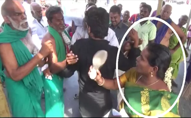 BJP Worker Slaps Farmer at TN Temple - Sakshi