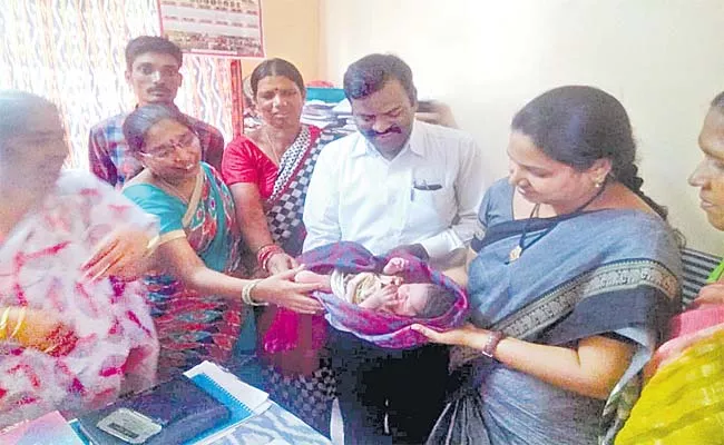 Parents who gave the girl child to ICDS officersవ - Sakshi
