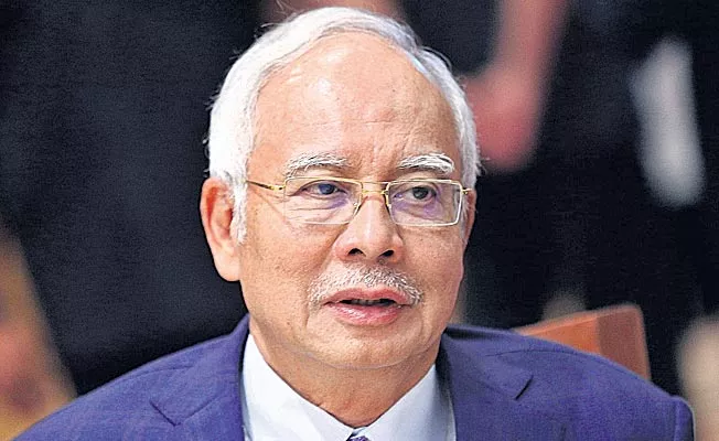 Cash, luxury items seized from ex-Malaysian PM Najib's residences - Sakshi