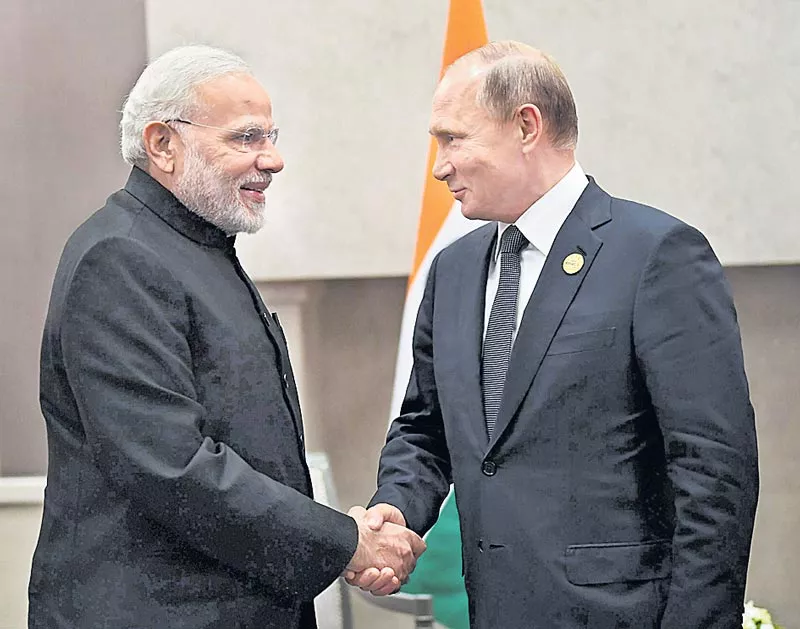 PM Modi holds bilateral talks with Putin on sidelines of BRICS summit - Sakshi