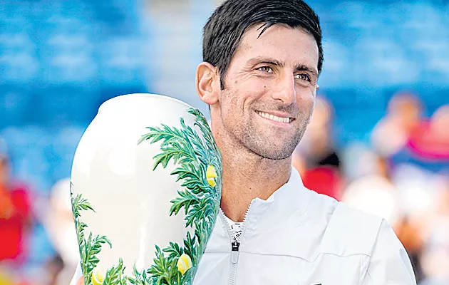 Novak Djokovic makes history with win over Roger Federer to complete the Golden Masters - Sakshi