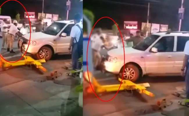 Vijayawada BJP Leader Tries to Hit Traffic Cop with Car - Sakshi