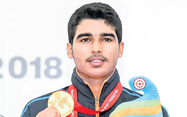 Saurabh Chaudhary shoots down junior record for gold at ISSF - Sakshi