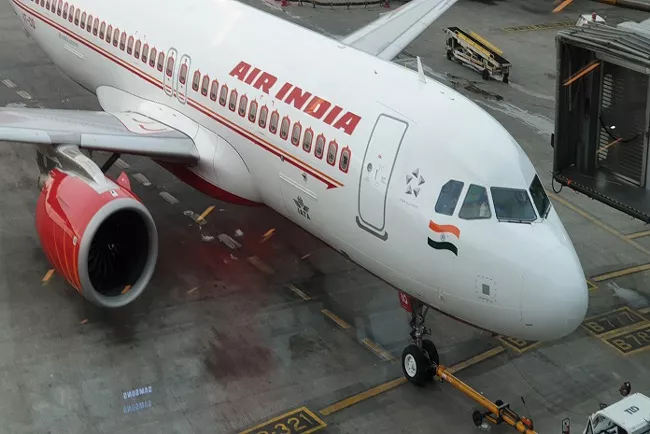 Air India flight escaped accident - Sakshi
