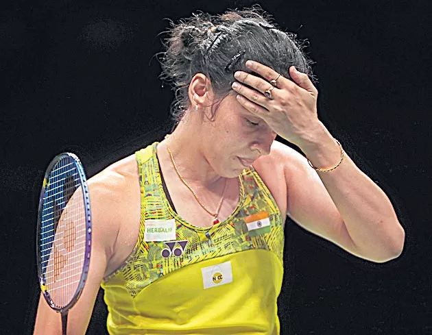 Saina nehwal exits French Open badminton - Sakshi