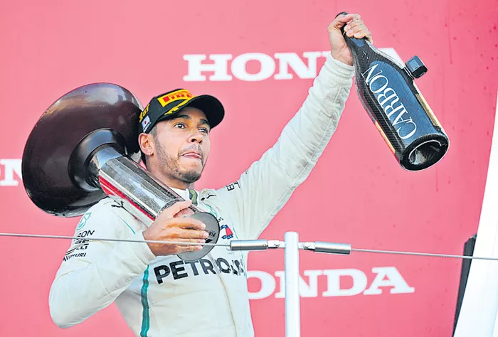 Japan win puts Lewis Hamilton on verge of world title - Sakshi