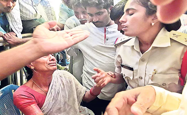 Police Harsh Behavior With Woman At CM Chandrababu Meeting - Sakshi