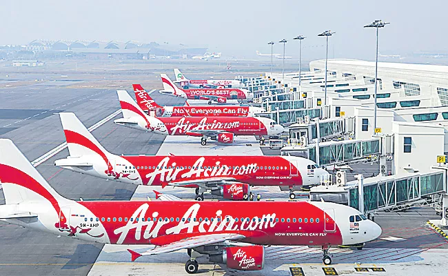 AirAsia offers domestic flight tickets from Rs 999, international at Rs 2,999 - Sakshi