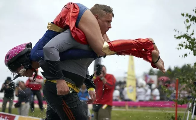 Lithuanian Couple Wins Wife Carrying World Championship - Sakshi