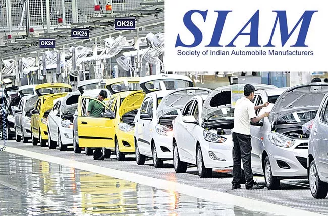 Auto companies slam brakes on production - Sakshi