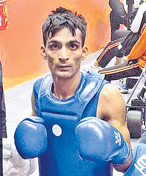 Praveen Kumar Gets Gold Medal Martial Arts - Sakshi