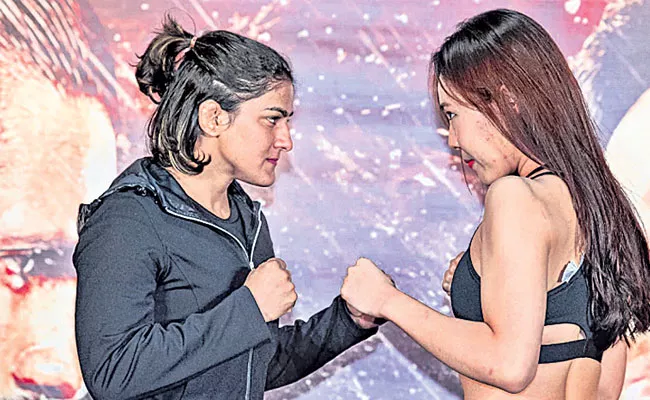 Ritu Phogat knocks Out Kim Nam Hee To Win On MMA Debut - Sakshi