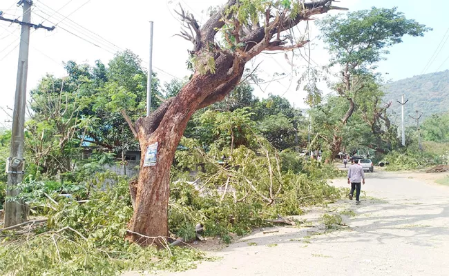 Power Department Employees Cutting Trees in GVMC - Sakshi