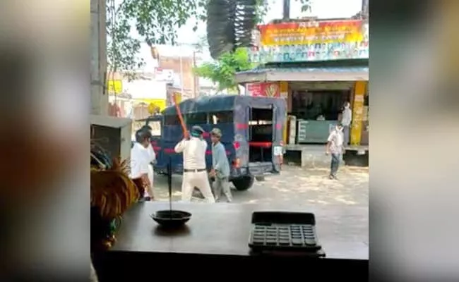 Two Cops Beat Man With batons In Madhya Pradesh Video Went Viral - Sakshi