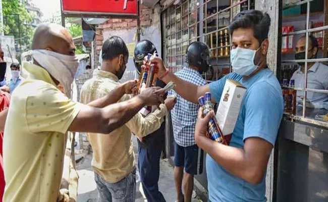 UP Government Warned Strict Action Against Those Selling Liquor At  Higher Rate - Sakshi