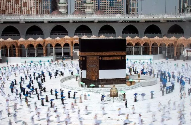 Hajj Pilgrims Social Distancing as They Circle Around Kaaba in Mecca - Sakshi
