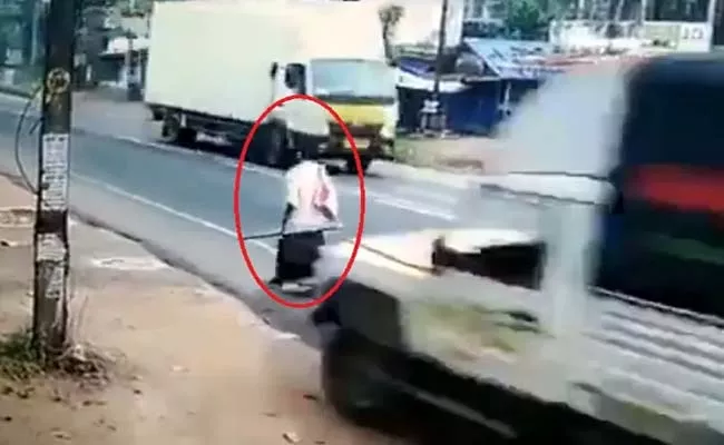 Viral Video: Speeding Truck Misses Him By Inches In Kerala - Sakshi