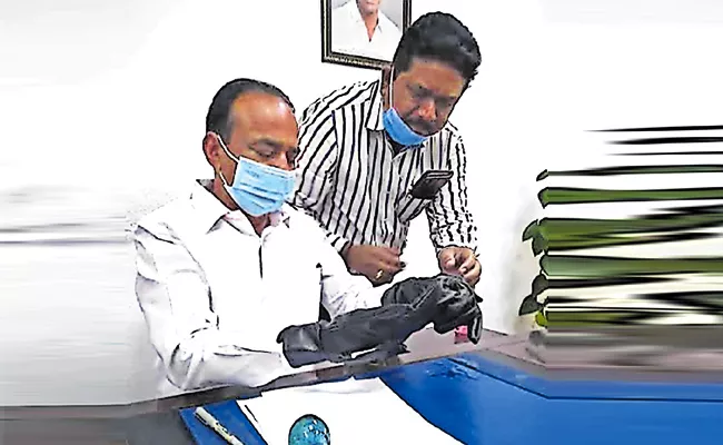 Security Agency Innovated Sanitizer Hand Gloves in Hyderabad - Sakshi