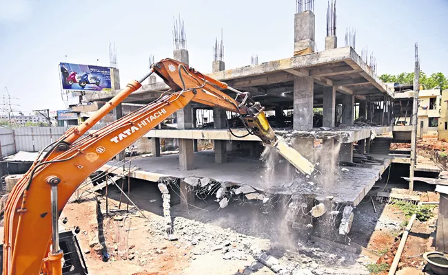 Demolition of illegal structure of former TDP MLA Palla Srinivasa Rao - Sakshi