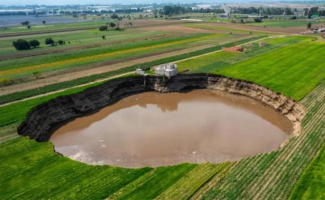 Giant Sinkhole Mexico Farm Swallows Family Home Viral - Sakshi