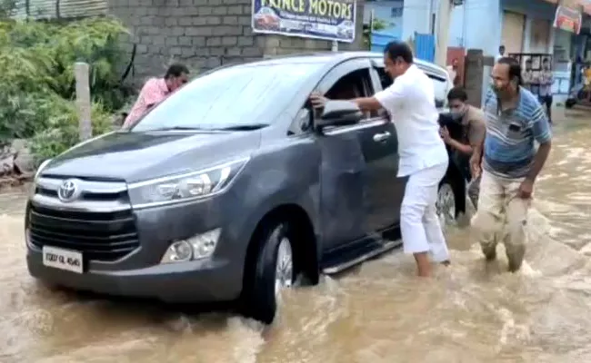 MLA Sudheer Reddy Car Trapped In Flood Waters - Sakshi