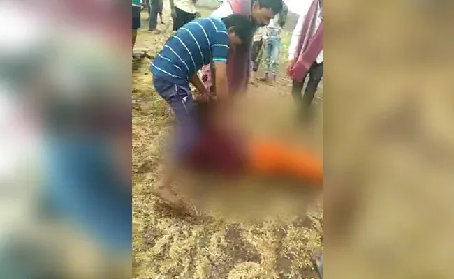 Woman Dragged By Hair And Thrashed Severly With Sticks Madhya Pradesh - Sakshi