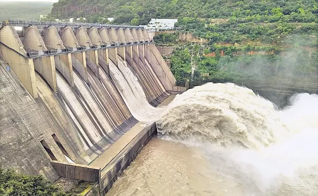Lifting of Srisailam Dam two gates Andhra Pradesh - Sakshi