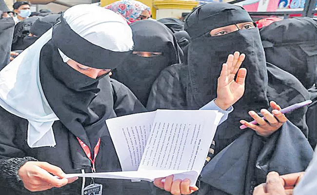Karnataka govt will abide by HC interim order on Hijab row - Sakshi
