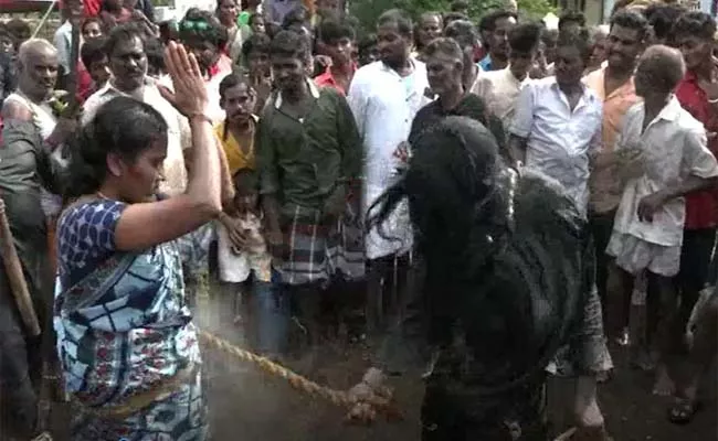 Priest In Tamil Nadus Whipping A Women Suspected Black Magic - Sakshi