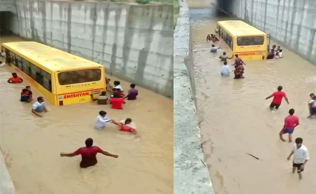 Private School Bus Carrying Students Stuck In Rain Water At RUB In Mahabubnagar - Sakshi