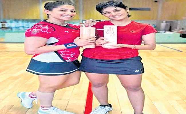 Ashwini-Tanisha win women's doubles title - Sakshi