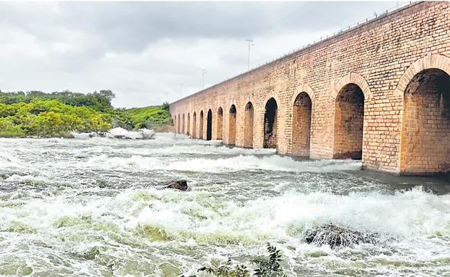 Godavari river is flowing with Flood Water At Telangana - Sakshi