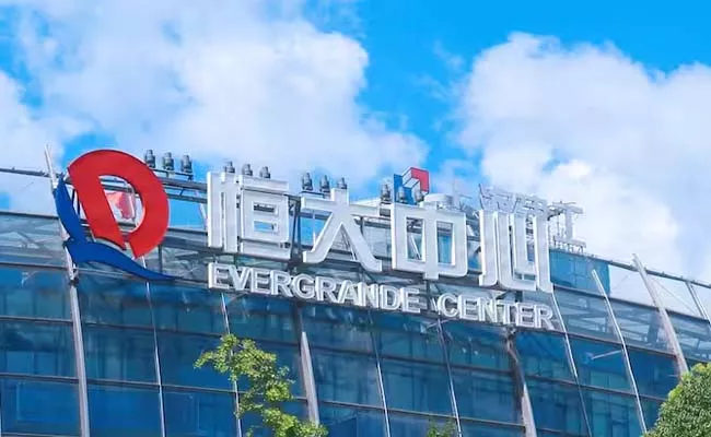 China Evergrande propels debt woes by filing for bankruptcy protection in US court - Sakshi