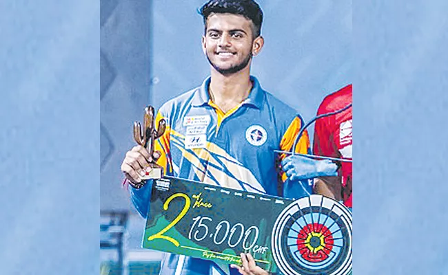 Indian player Prathamesh Jakar won silver medal - Sakshi