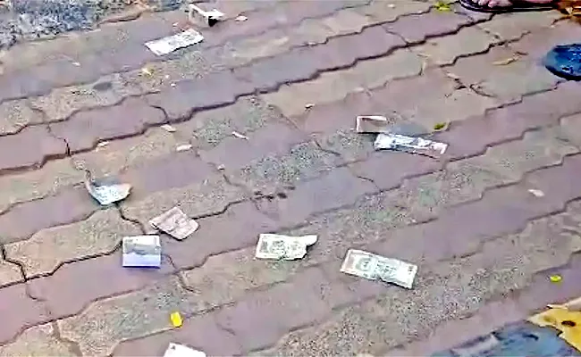 Enraged Customers Throw Torn Currency In Air At Bhubaneswar RBI Office - Sakshi