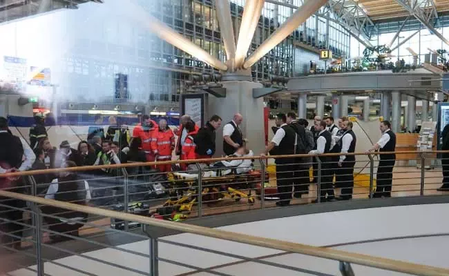 Hamburg Airport Man Drives on Tarmac Fires Shots - Sakshi