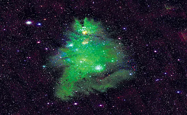 NASA Finds Christmas Tree Cluster Twinkling in Space - Sakshi