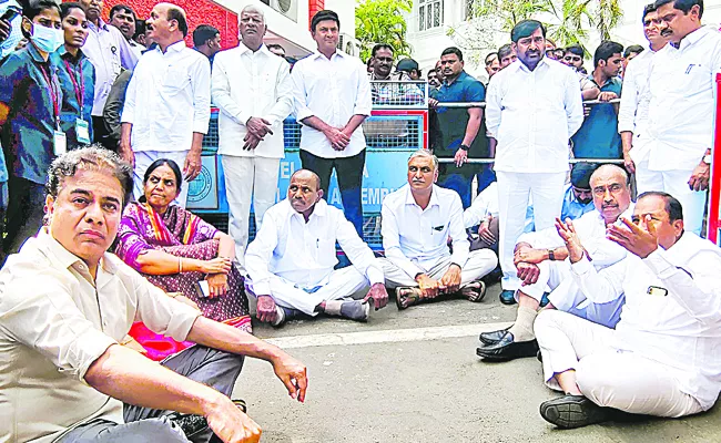 The BRS MLAs protested by sitting on the floor outside the Assembly - Sakshi