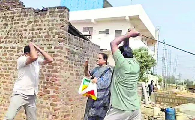 Attack on three people who prevented land grab - Sakshi