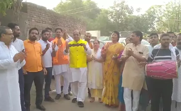 BJP MLA comes out to vote playing cymbal and Dhol