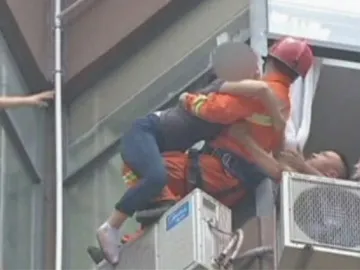 Firefighter Walks On Narrow Ledge To Save Suicidal Woman On 15th Floor