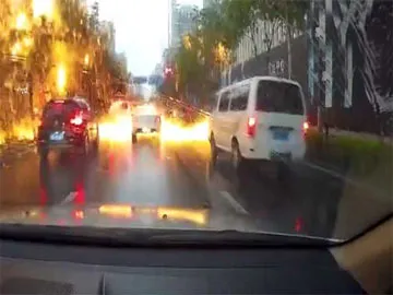 Lightning Strike Leaves Shower Of Sparks On Busy Street In China