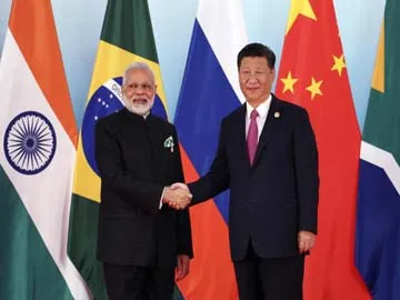 Xi Jinping , PM Modi display bonhomie