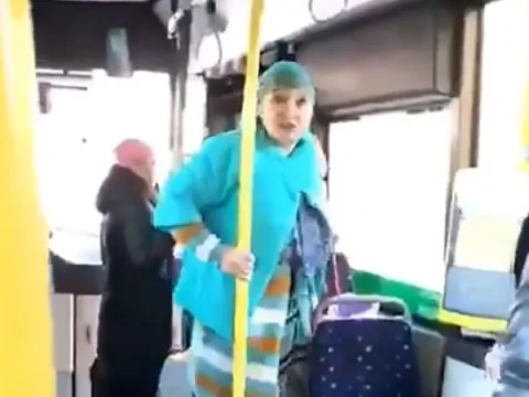 grand mother kick the drunk youth in the bus