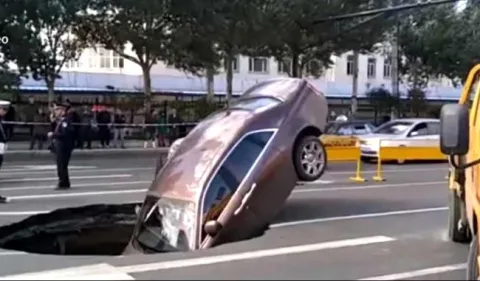 Rolls-Royce Plunges Into Sinkhole