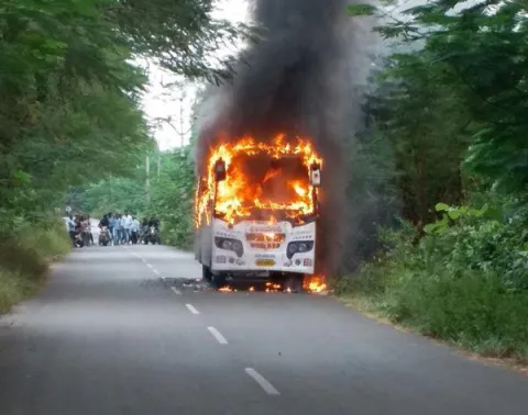 Private Bus Catches Fire in vizianagaram district - Sakshi
