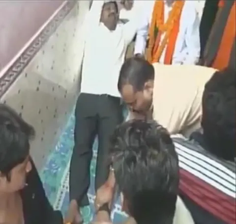 UP minister Nand Gopal gets foot massage by BJP workers - Sakshi